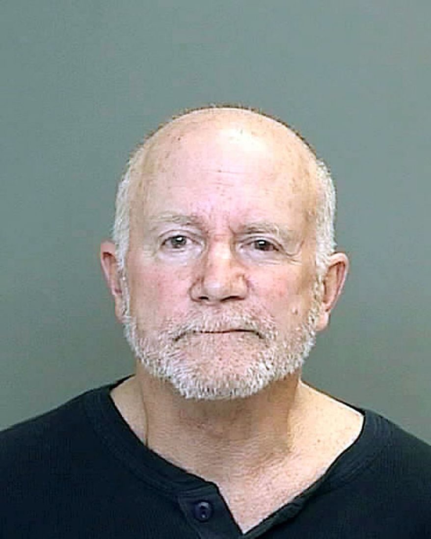 In a booking photo provided by the Dearborn, Mich., police department, Roger Stockham is shown. (Associated Press)