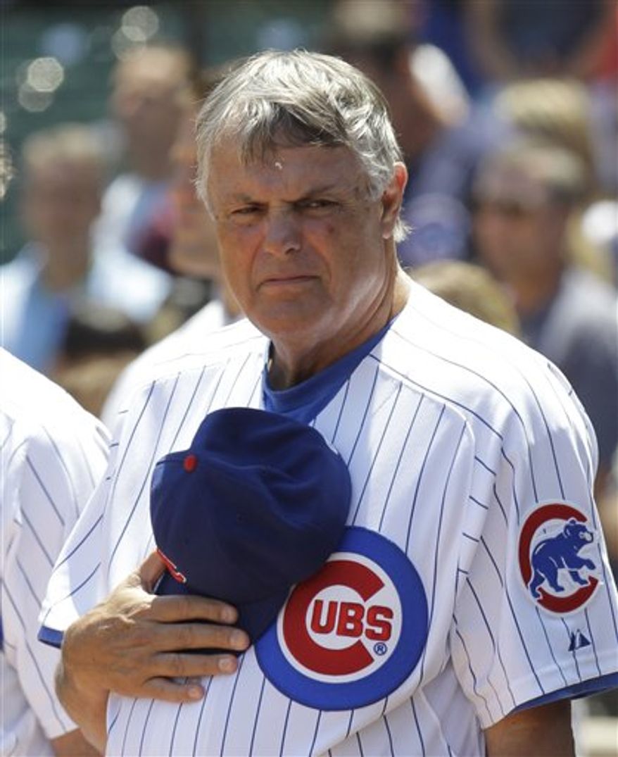 In this Thursday, June 17, 2010, file photo, Chicago Cubs manager Lou Piniella stands during the national anthem before an interleague baseball game against the Oakland Athletics at Wrigley Field in Chicago. The longtime skipper told The Associated Press on Wednesday, Feb. 2, 2011, he has agreed to a one-year contract with the San Francisco Giants to work as a special assistant for the World Series champions. Sweet Lou will report to general manager Brian Sabean. (AP Photo/Charles Rex Arbogast)