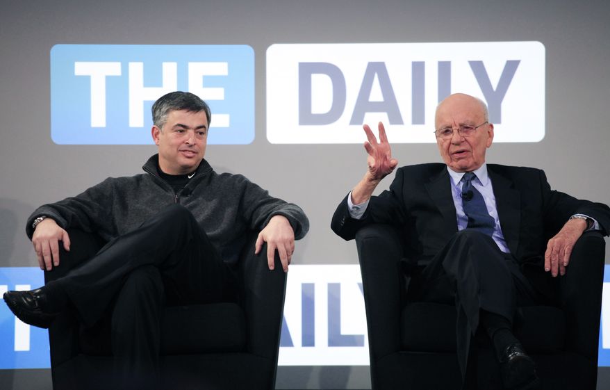 Rupert Murdoch, right, Chairman and CEO of News Corp., and Eddy Cue, vice president of Apple, attend the launch of the Daily, Wednesday, Feb. 2, 2011 in New York. The Daily is the world's first iPad-only newspaper. (AP Photo/Mark Lennihan)