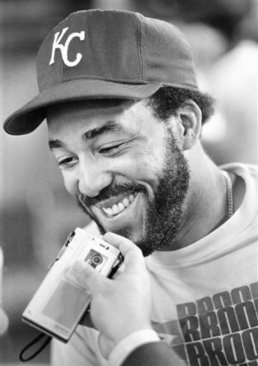 FILE - In this Oct. 9, 1980 file photo, Kansas City Royals baseball Willie Mays Aikens is all smiles as he recorded tape for Latin American radio in the clubhouse at Royals Stadium in Kansas City. Aikens, who went from World Series star to federal prison inmate, has been hired by the Kansas City Royals as a minor league coach on Tuesday, Feb. 1, 2010. (AP Photo/John Filo, File)