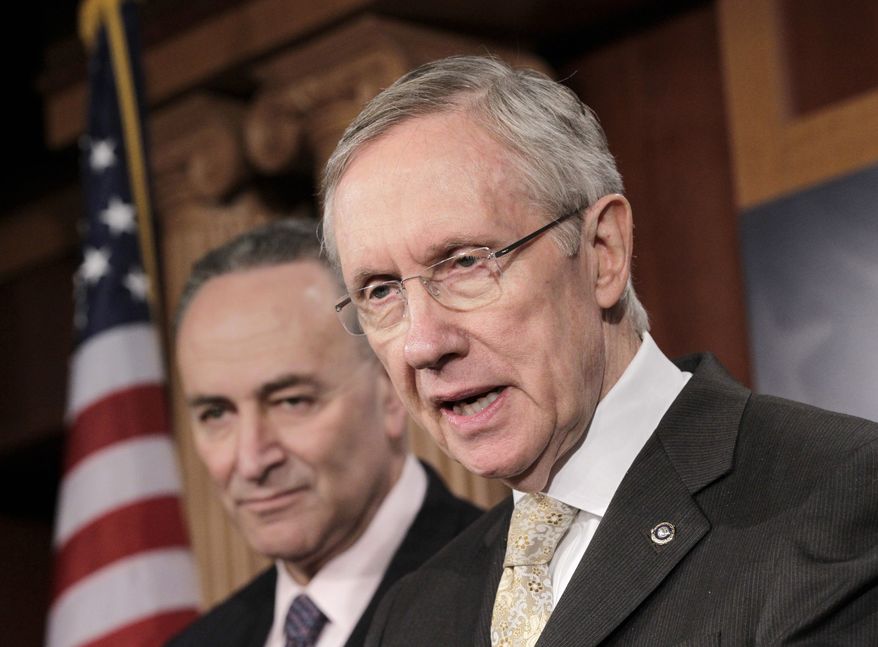 ** FILE ** Senate Majority Leader Harry Reid of Nevada, accompanied by Sen. Charles Schumer, D-N.Y., speaks during a news conference on Capitol Hill in Washington on Tuesday, Feb. 2, 2011. (AP Photo/J. Scott Applewhite)