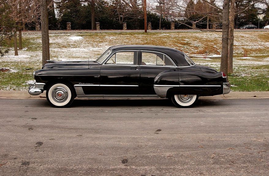 The profile of the two-ton Cadillac on its 126-wheelbase reveals why the car delivers a cushy ride.