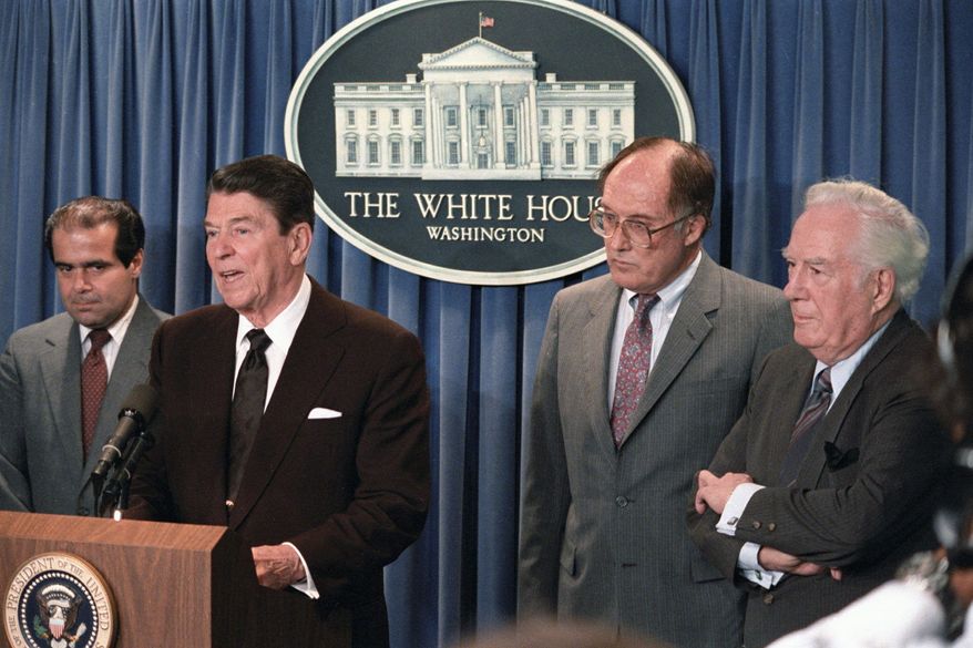 President Reagan announces the resignation of Chief Justice Warren E. Burger (right) during a briefing at the White House on June 17, 1986. Reagan said he would nominate Justice William H. Rehnquist (second from right) to the post of chief justice and Antonin Scalia (left) as a member of the Supreme Court. (Associated Press)