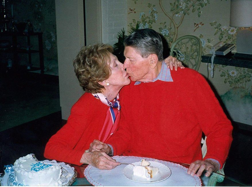 Former President Ronald Reagan celebrates with his wife, Nancy, at their Bel-Air home in Los Angeles on Feb. 6, 2000, Reagan&#39;s 89th birthday. Reagan died four years later of pneumonia, a common Alzheimer&#39;s disease complication. (Associated Press)