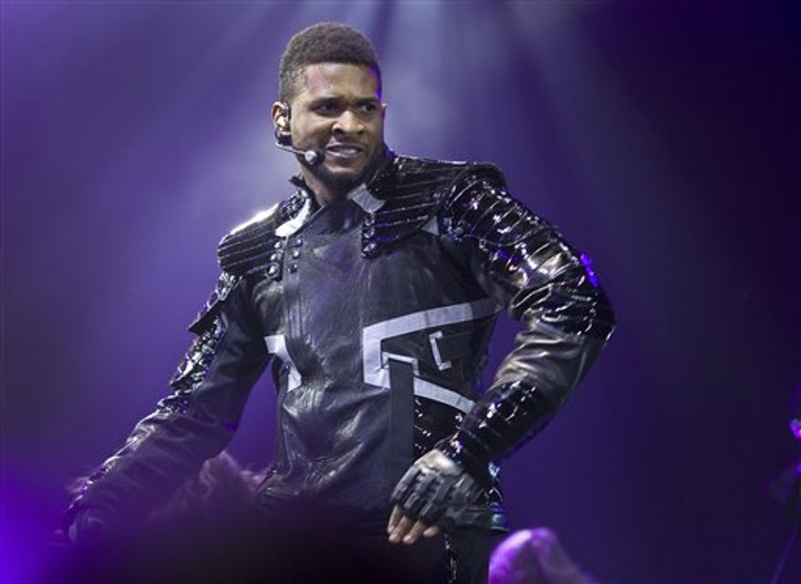 US musician Usher performs at the o2 arena, Wednesday, Feb. 2, 2011, in London. (AP Photo/Joel Ryan )