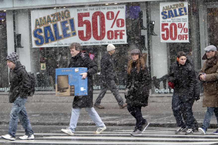 ** FILE ** Shoppers make their way in the snow in Union Square in New York on Sunday, Dec. 26, 2010. Major retailers are reporting surprisingly solid January revenue gains despite snowstorms that many feared would chill spending. (AP Photo/Mary Altaffer, File)