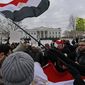 Egyptian flags wave during a Jan. 29 demonstration in front of the White House demanding that Egyptian President Hosni Mubarak step down. (Associated Press)