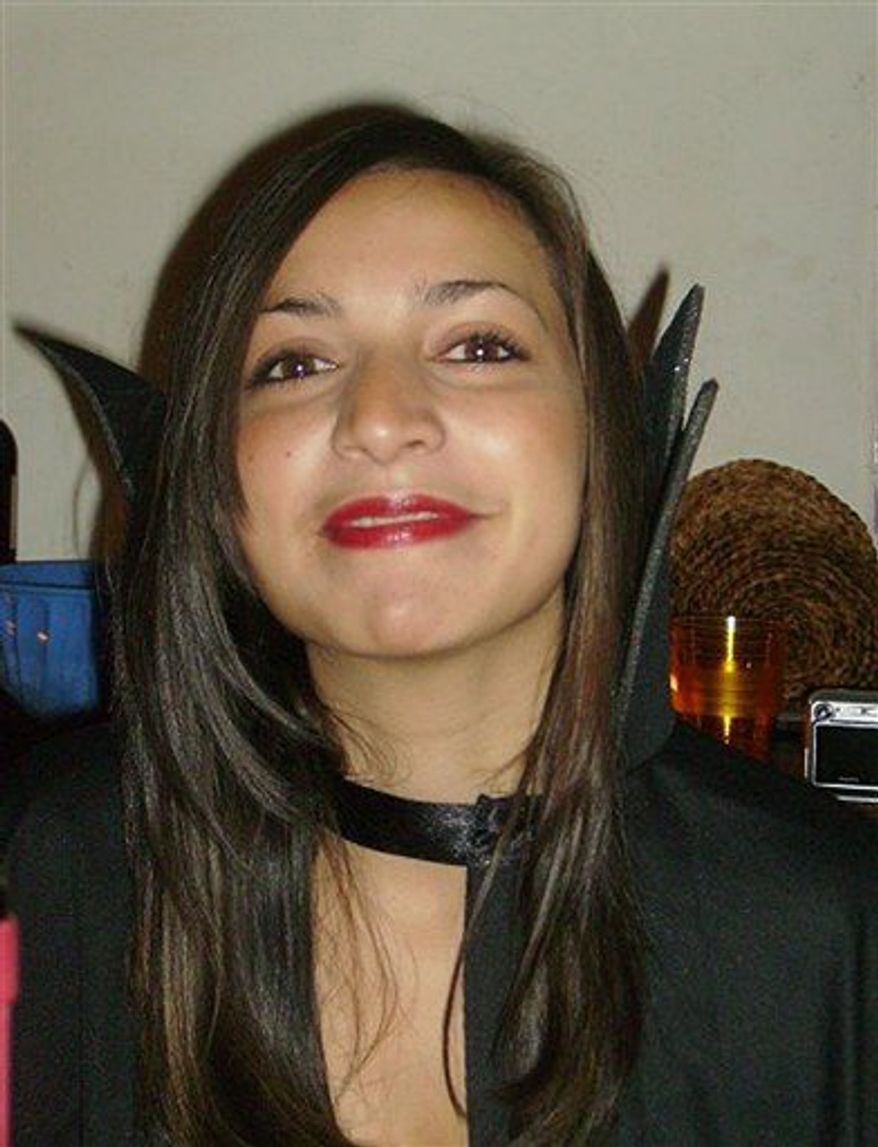 FILE - This is an undated file photo released by the Italian Police of 22-year-old murdered British university student Meredith Kercher, The father of slain British student Meredith Kercher is criticizing a U.S. television re-enactment for depicting alleged scenes of his daughter's murder in the Italian city of Perugia. The Lifetime movie is based on the trial that followed Meredith Kercher's stabbing death on Nov. 1, 2007 a killing for which Kercher's roommate, University of Washington student Amanda Knox, was found guilty, along with two men. They have all proclaimed their innocence. (AP Photo/Italian Police, File) EDITORIAL USE ONLY