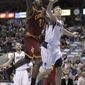 Cleveland Cavaliers power forward J.J. Hickson (21) shoots against Dallas Mavericks power forward Dirk Nowitzki (41) during the first half of a NBA basketball game in Dallas on Monday, Feb. 7, 2011. (AP Photo/LM Otero)