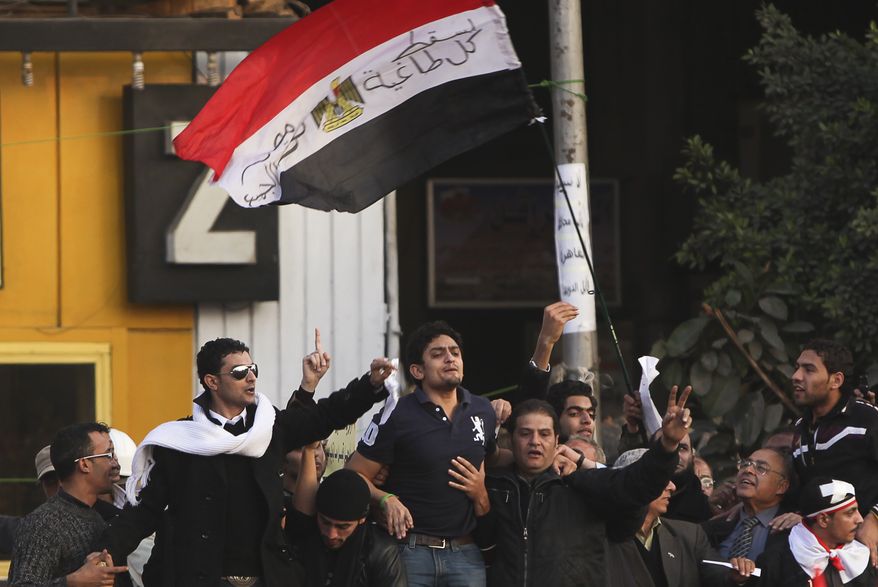 Wael Ghonim (center), the 30-year-old Google Inc. marketing manager who was a key organizer of the online campaign that sparked the first Egyptian protest on Jan. 25, talks to the crowd in Tahrir Square in Cairo on Tuesday, Feb. 8, 2011. Newly released from detention, Mr. Ghonim was greeted by cheers, whistling and thunderous applause when he declared, "We will not abandon our demand, and that is the departure of the regime." (AP Photo/Tara Todras-Whitehill)