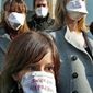 Lawyers wearing masks reading &quot;Forbidden of Expression&quot; protest with judges in front of the Justice Palace in Nice, France, on Thursday during a national protest by judges and lawyers against criticism by French President Nicolas Sarkozy of the legal system. (Associated Press)