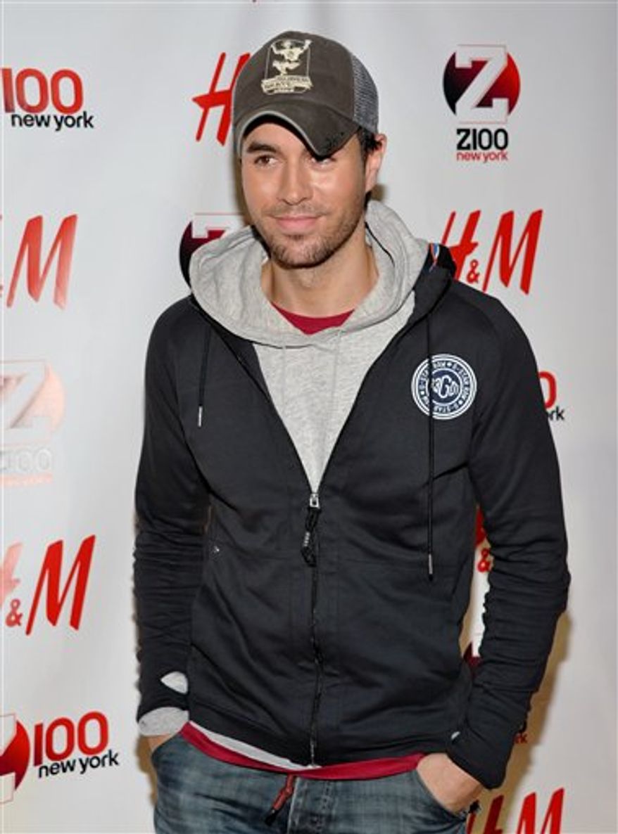 FILE - In this Dec. 10, 2010 file photo, singer Enrique Iglesias performs at the 2010 Z100 Jingle Ball concert at Madison Square Garden in New York. glesias dominates the list of finalists for the 22nd Billboard Latin Music awards with 14 nominations. Telemundo announced the nominees for the April 28, 2011, award ceremony to be aired live from the BankUnited Center at the University of Miami. (AP Photo/Peter Kramer, file)