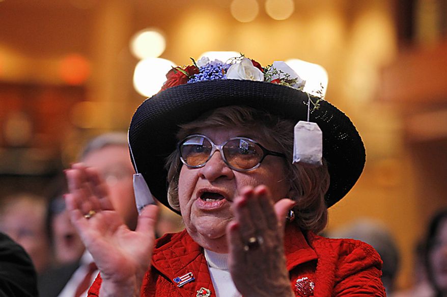 Martha Stamp of Wakefield, R.I., applauds as Rep. Michele Bachmann, Minnesota Republican, addresses the Conservative Political Action Conference (CPAC) in Washington on Thursday, Feb. 10, 2011. (AP Photo/Alex Brandon)