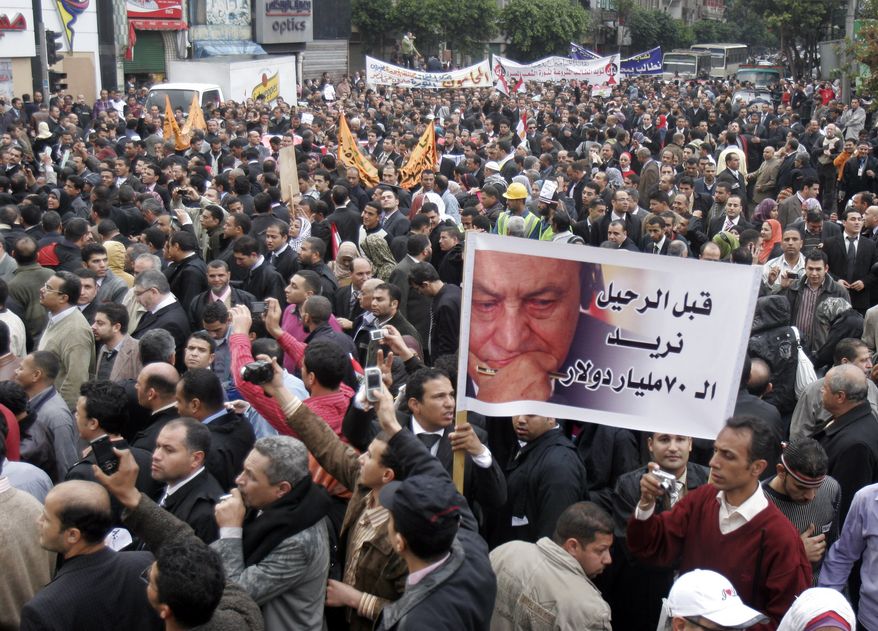 Egyptian lawyers in black robes stream into Cairo's Tahrir Square, Thursday, Feb. 10, 2011. Labor unrest across the country gave powerful momentum to Egypt's wave of anti-government protests. (AP Photo/ Mohammed Abou Zaid)