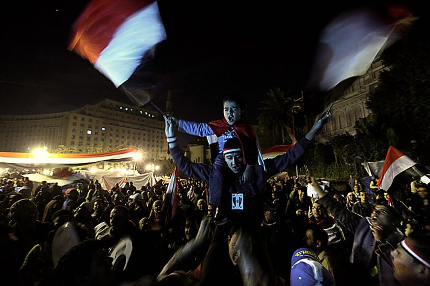 Anti-government protesters celebrate in Tahrir Square in downtown Cairo, Egypt, Thursday, Feb. 10, 2011. Egypt's military announced on national television it had stepped in to secure the country and promised protesters calling for President Hosni Mubarak's ouster that all their demands would soon be met. Tens of thousands of protesters packed in central Tahrir broke into chants of 'We're almost there, we're almost there' and waved V-for-victory signs as thousands more flowed in to join them well after nightfall. (AP Photo/Amr Nabil)