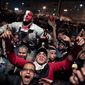 Egyptians celebrate the news of the resignation of President Hosni Mubarak, who handed control of the country to the military, at night in Tahrir Square in downtown Cairo, Egypt, on Friday, Feb. 11, 2011. (AP Photo/Tara Todras-Whitehill)