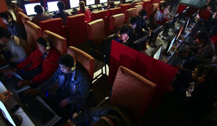 People use computers at an Internet cafe in Fuyang, in central China&#39;s Anhui province, on March 12, 2010.  (Associated Press)