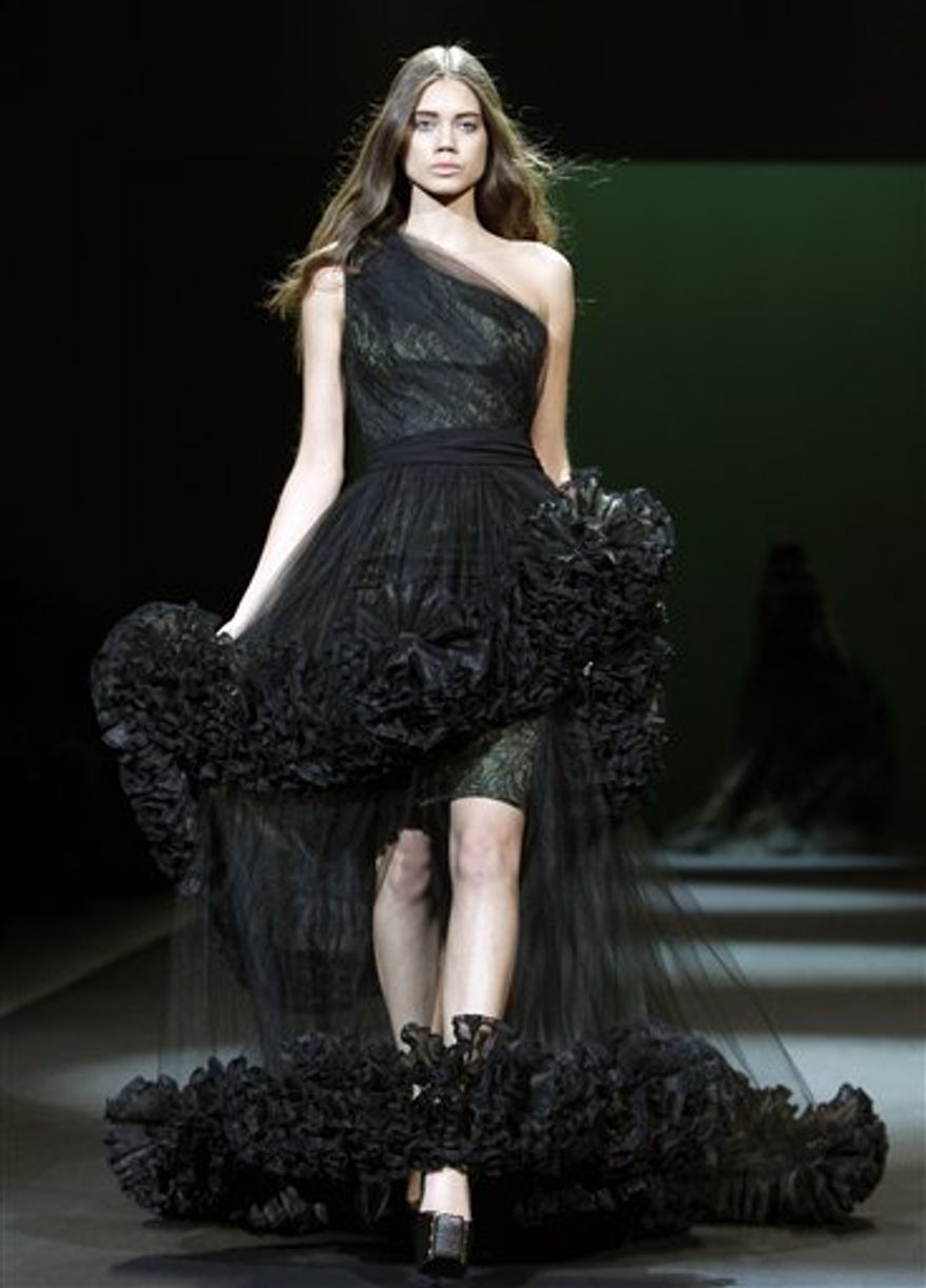 A model slips and falls during the Christian Siriano Fall 2011 show at Lincoln Center in New York, Thursday, Feb. 10, 2011. (AP Photo/)