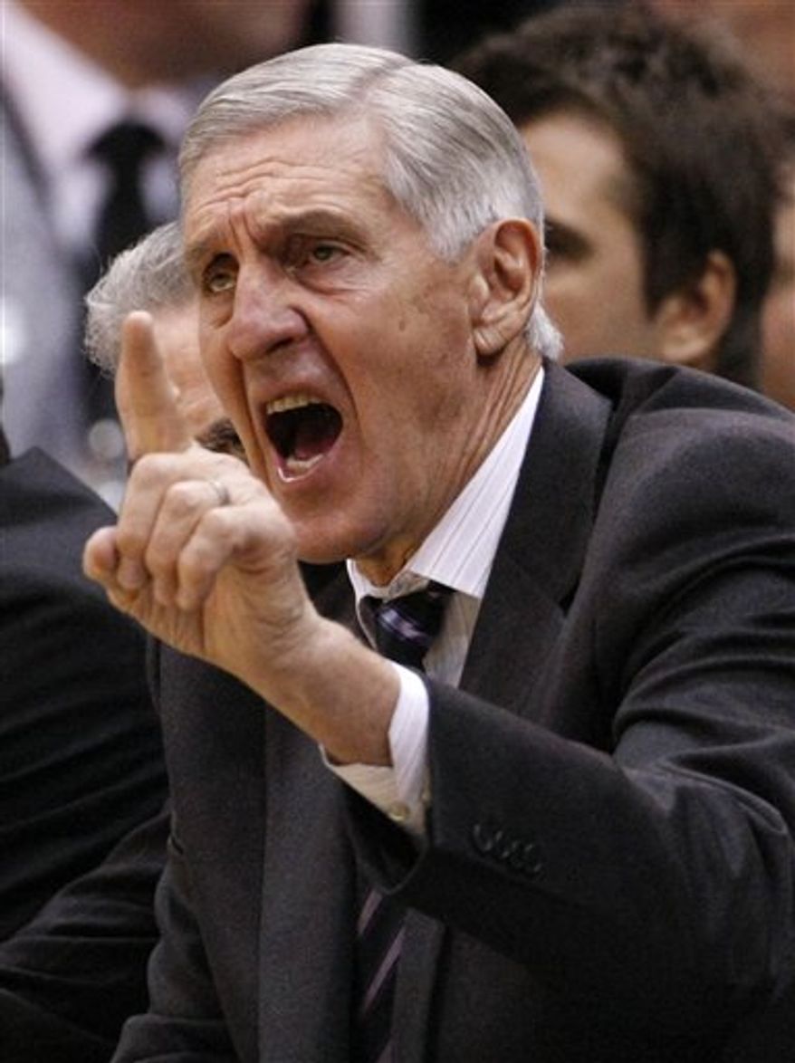 FILE - This Nov. 12, 2010, file photo shows Utah Jazz head coach Jerry Sloan during an NBA basketball game against the Atlanta Hawks,  in Atlanta. A person with knowledge of the situation says Sloan is stepping down as head coach of the Jazz. The person also told The Associated Press on Thursday, Feb. 10, 2011,  that longtime assistant Phil Johnson also will resign.(AP Photo/John Bazemore, File)