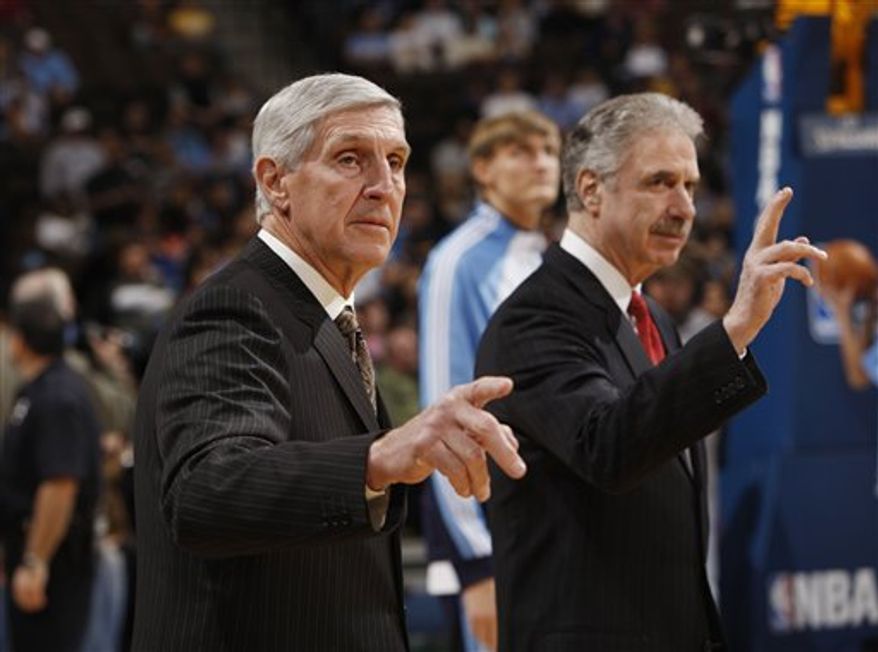 FILE - This jan. 17, 2010, file photo shows Utah Jazz head coach Jerry Sloan, front, and assistant coach Phil Johnson waving before facing the Denver Nuggets in the first quarter of an NBA basketball game,  in Denver. A person with knowledge of the situation says Sloan is stepping down as head coach of the Jazz. The person also told The Associated Press on Thursday, Feb. 10, 2011,  that longtime assistant Phil Johnson also will resign. (AP Photo/David Zalubowski)