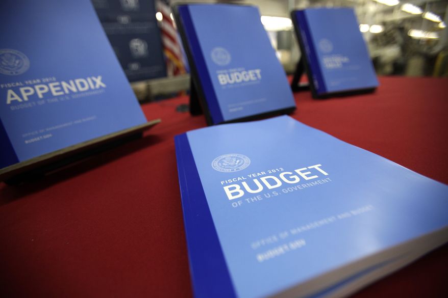 The 2012 federal budget is on display at the U.S. Government Printing Office at Washington on Thursday, Feb. 10, 2011. (AP Photo/Jacquelyn Martin)