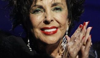 FILE- In this Sept. 27, 2007 file photo, actress Elizabeth Taylor is shown at the Macy&#39;s Passport 2007 charity benefit in Santa Monica, Calif. Taylor has entered her second month at Cedars-Sinai Medical Center in Los Angeles, where she is being treated for symptoms of congestive heart failure. Publicist Jamie Cadwell said Tuesday, March 15, 2011 that the 79-year-old actress remains hospitalized after she was admitted to Cedars-Sinai in early February. (AP Photo/Dan Steinberg, File)