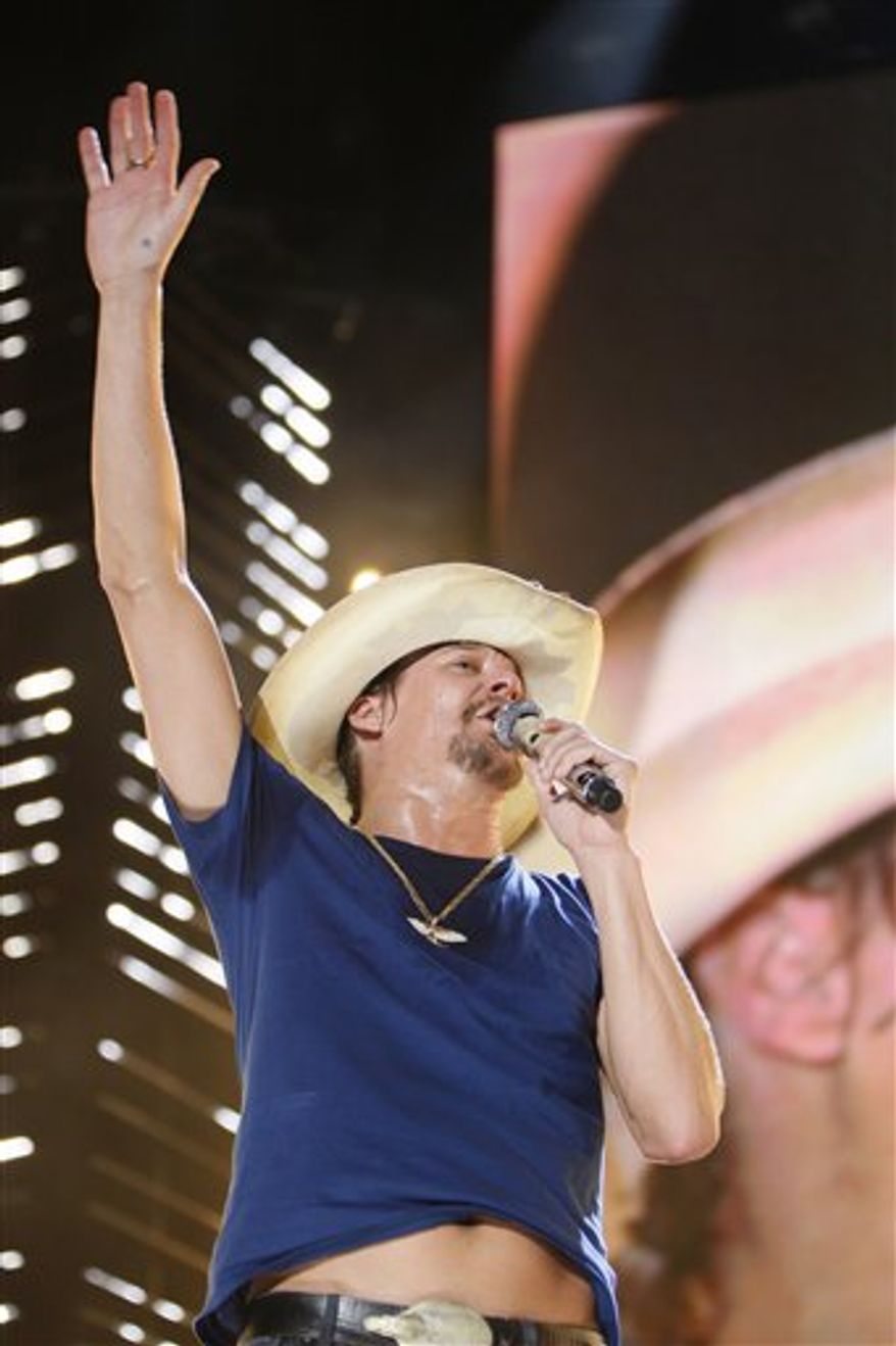 FILE - In this June 11, 2010 file photo, Kid Rock performs during the CMA Music Festival in Nashville, Tenn. (AP Photo/Wade Payne, file)
