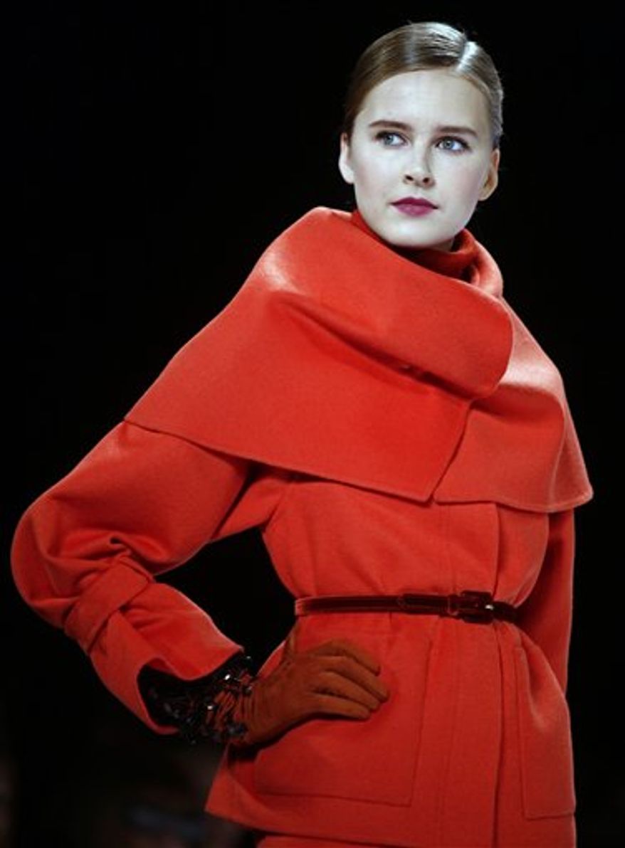Fashion from the fall 2011 collection of Carolina Herrera is modeled on Monday, Feb. 14, 2011 in New York. (AP Photo/Bebeto Matthews)