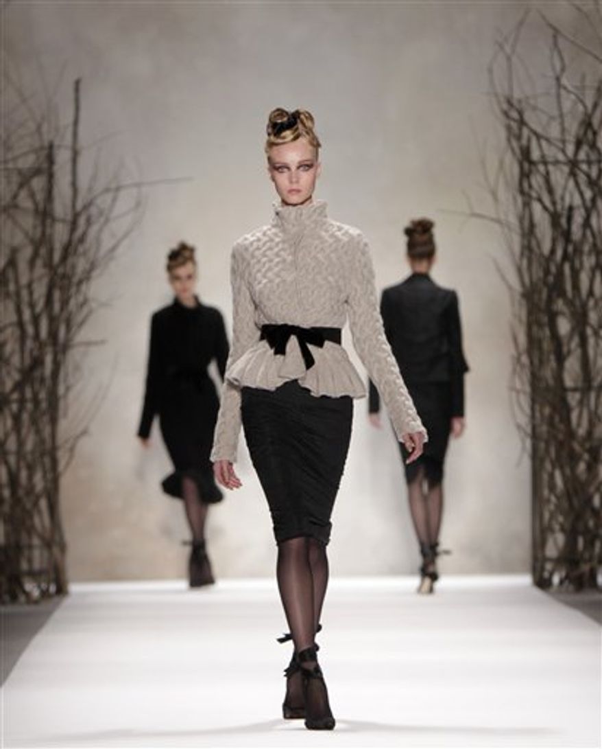 Fall 2011 fashion from Monique Lhuillier is modeled during Fashion Week in New York, Monday, Feb. 14, 2011. (AP Photo/Seth Wenig)