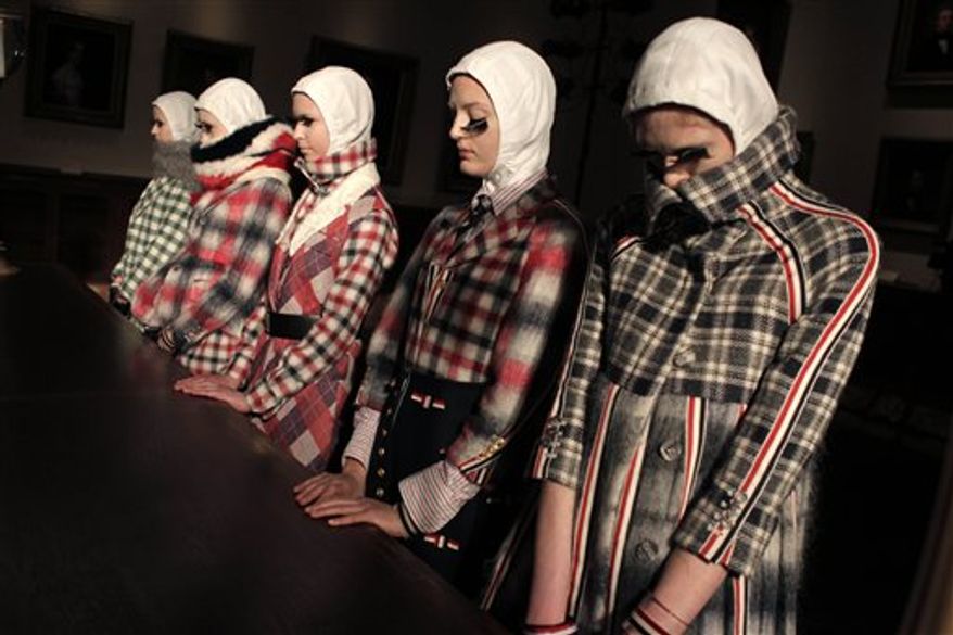 Fall 2011 fashion from Thom Browne is modeled during Fashion Week in New York, Monday, Feb. 14, 2011. (AP Photo/Seth Wenig)
