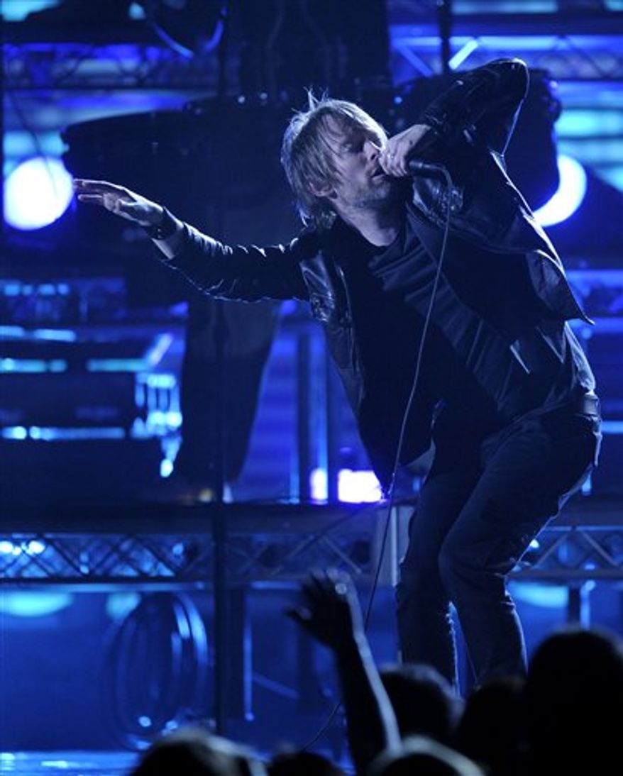 FILE - In this Feb. 8, 2009 file photo, Thom Yorke, lead singer for Radiohead, performs with the USC marching band at the 51st Annual Grammy Awards in Los Angeles. The band announced Monday, Feb. 14, 2011, that their latest release, "The King of Limbs," will be available as early as Saturday. Unlike its last pay-what-you-want album, "In Rainbows," this one will have a price. (AP Photo/Mark J. Terrill, file)