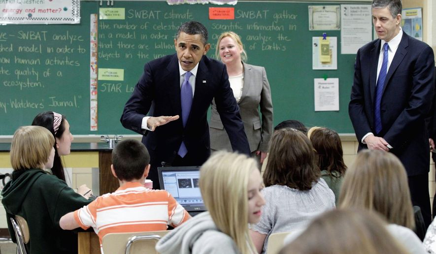 EDUCATION INITIATIVE: President Obama visits teacher Susan Yoder&#39;s science class at Parkville Middle School and Center of Technology in Parkville, Md., on Monday. Mr. Obama&#39;s $3.7 trillion fiscal 2012 budget boosts overall education spending by 11 percent. (Associated Press)