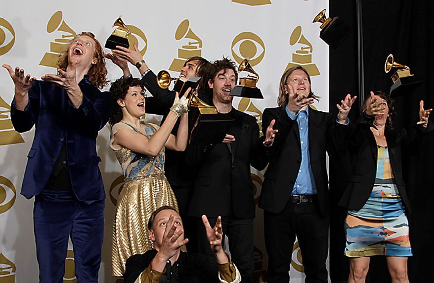 Arcade Fire pose backstage with the award for album of the year at the 53rd annual Grammy Awards on Sunday, Feb. 13, 2011, in Los Angeles. (AP Photo/Jae C. Hong)
