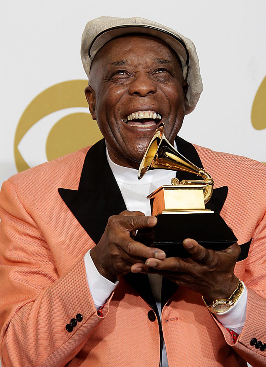 Buddy Guy poses backstage with the award for best contemporary blues album at the 53rd annual Grammy Awards on Sunday, Feb. 13, 2011, in Los Angeles. (AP Photo/Jae C. Hong)