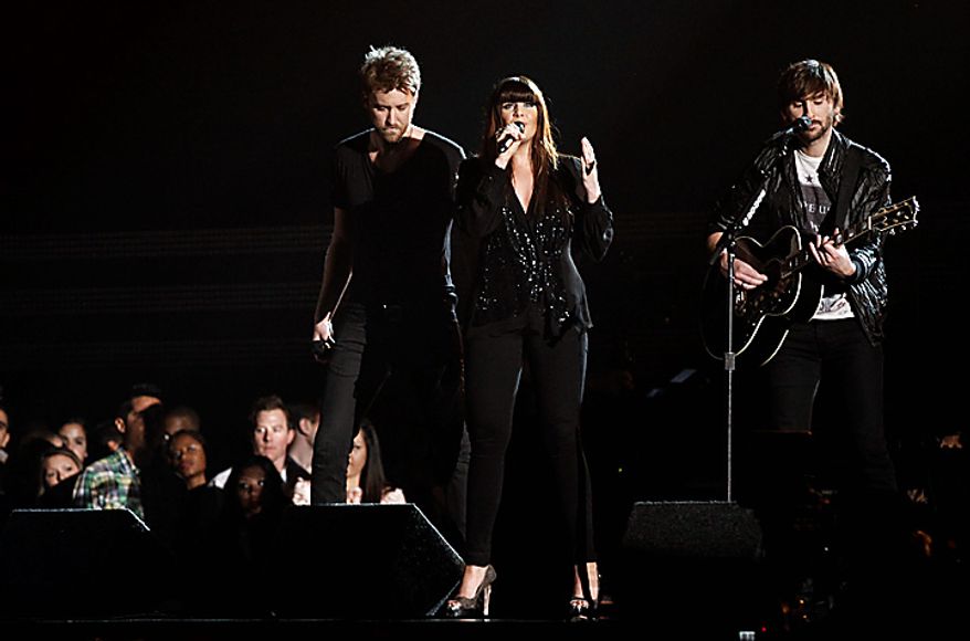 Lady Antebellum, from left, Charles Kelley, Hilary Scott, and Dave Haywood, perform at the 53rd annual Grammy Awards on Sunday, Feb. 13, 2011, in Los Angeles. (AP Photo/Matt Sayles)