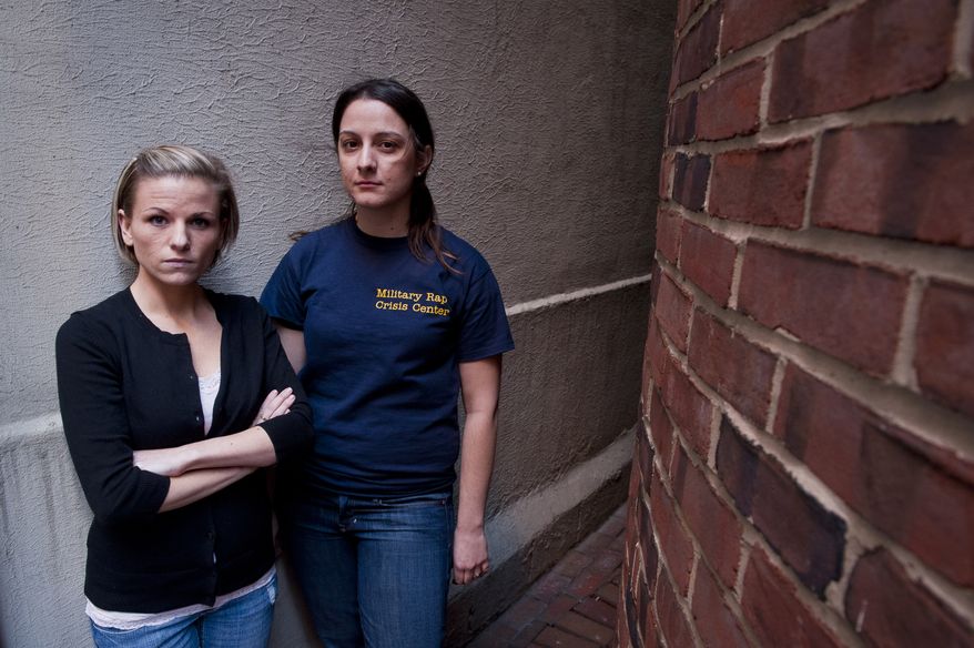 **FILE** Veterans Kori Cioca (left), 25, of Wilmington, Ohio, and Panayiota Bertzikis, 29, of Somerville, Mass., who were assaulted and raped while serving in the U.S. Coast Guard, meet at their attorney's office in Washington on Feb. 13, 2011. They are plaintiffs among about a dozen women and at least one man, who are suing Pentagon officials, seeking change in the military's handling of rape and sexual assault cases. (Associated Press)