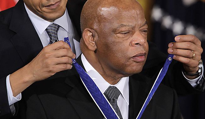 ** FILE ** President Barack Obama presents Rep. John Lewis, D-Ga., the 2010 Medal of Freedom during a ceremony in the East Room of the White House in Washington, Tuesday, Feb. 15, 2011. (AP Photo/Charles Dharapak)