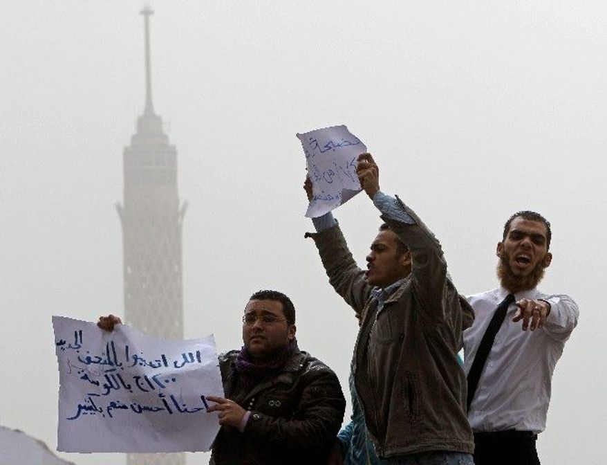 Jobless archeology graduates protest to demand jobs in the Egyptian Museum in Cairo on Wednesday. Strikes and protests erupted in Egypt after the uprising that toppled President Hosni Mubarak. (Associated Press)