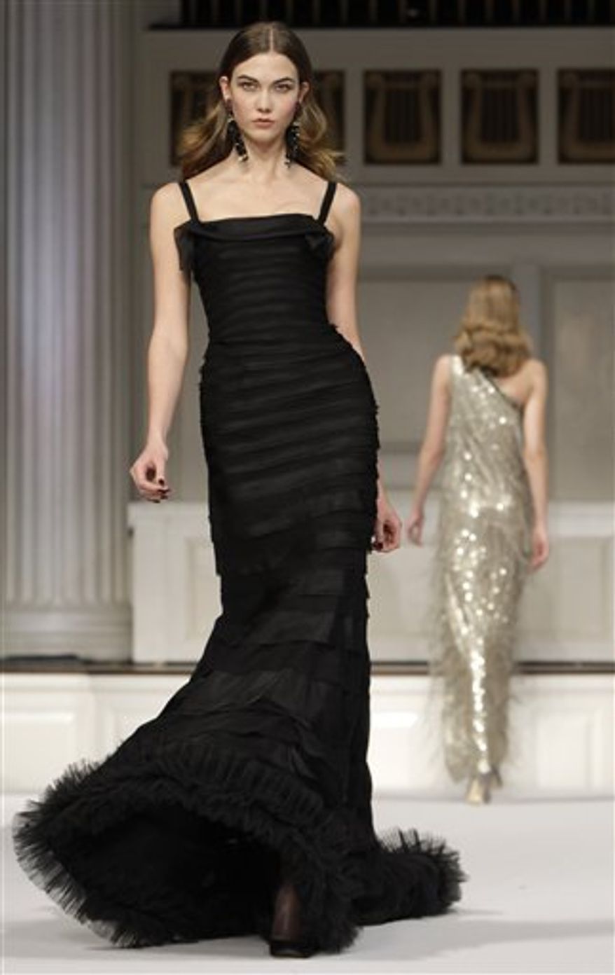 A model walks the runway at the Oscar de la Renta Fall 2011 show during Fashion Week in New York, Wednesday, Feb. 16, 2011. (AP Photo/Kathy Willens)