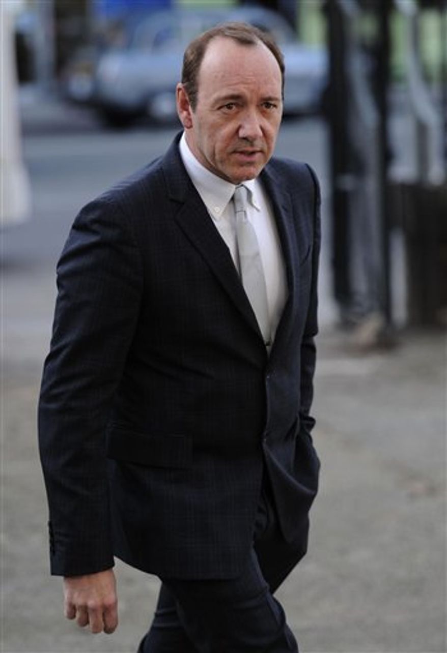 British actor Daniel Day-Lewis leaves a memorial service for actor Pete Postlethwaite at Saint Leonard's Church, in Shoreditch, east London Wednesday, Feb. 16, 2011. Oscar-nominated actor Pete Postlethwaite died in January, aged 64. (AP Photo/ Carl Court/PA) UNITED KINGDOM OUT NO SALES NO ARCHIVE