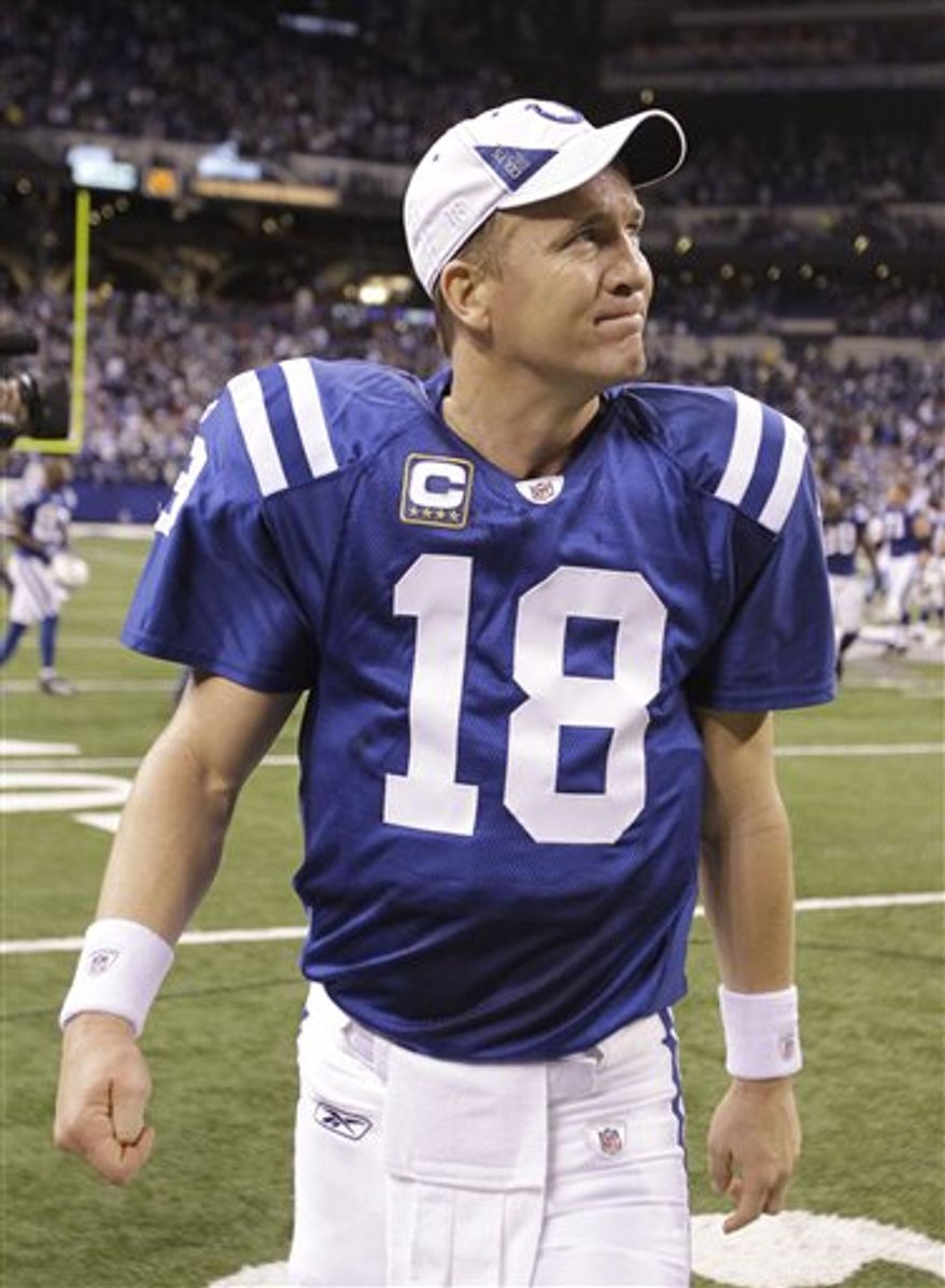 FILE - In this Jan. 2, 2011 file photo, Indianapolis Colts quarterback Peyton Manning walks off the field after a 23-20 win over the Tennessee Titans in an NFL football game in Indianapolis. Manning, the only four-time MVP in league history, has been given the exclusive franchise tag, a move that could cost the Colts $23 million next season. Team owner Jim Irsay announced the decision Tuesday night, Feb. 15, 2011 on Twitter. (AP Photo/Michael Conroy, File)