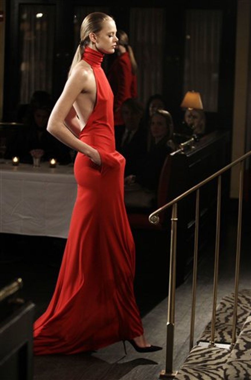 A model walks through the Monkey Bar during the presentation of the Bill Blass Fall 2011 collection during Fashion Week in New York, Thursday, Feb. 17, 2011. (AP Photo/Kathy Willens)