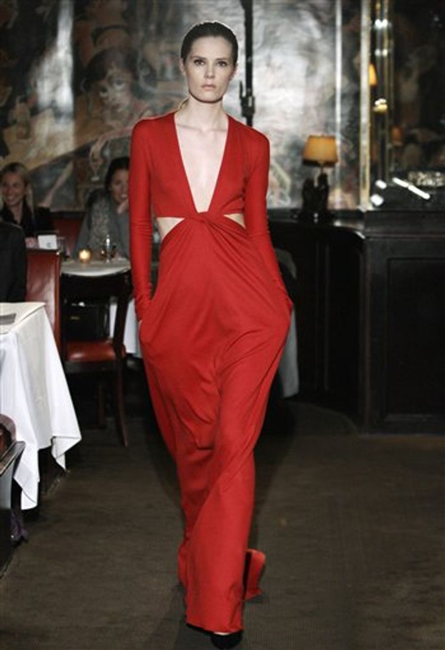 A model walks through the Monkey Bar during the presentation of the Bill Blass Fall 2011 collection during Fashion Week in New York, Thursday, Feb. 17, 2011. (AP Photo/Kathy Willens)