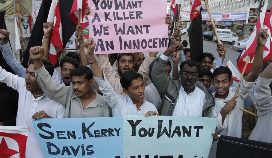 Supporters of the Pakistani religious party Jammat-e-Islami rally in Karachi, Pakistan, on Wednesday, Feb. 16, 2011, against U.S. Consulate employee Raymond Davis, who allegedly shot dead two Pakistanis whom Mr. Davis has said were trying to rob him. (AP Photo/Shakil Adil)