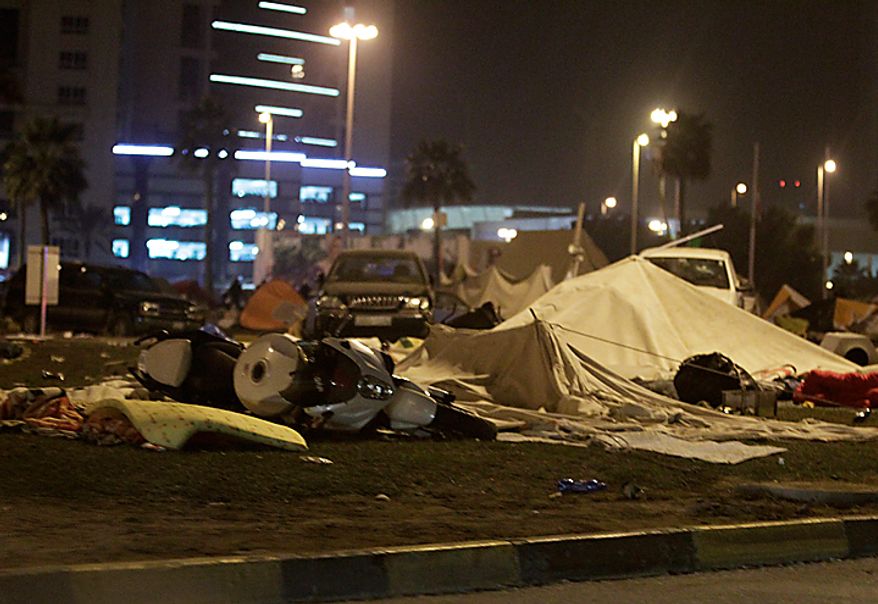 Anti-government demonstrators' damaged tents at Pearl Square in Manama, Bahrain, early Thursday morning, Feb. 17, 2011, after riot police attacked them. Riot police firing tear gas and rubber bullets stormed the landmark square occupied by anti-government protesters Thursday, driving out demonstrators and destroying a makeshift encampment that had become the hub for demands to bring sweeping political changes to the kingdom. (AP Photo/Hassan Ammar)