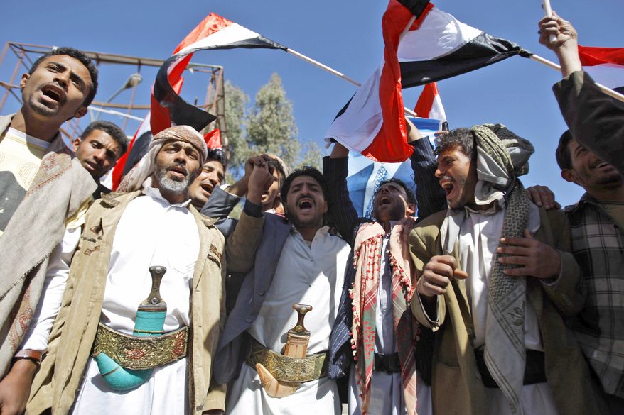 Supporters of the Yemeni government chant slogans during clashes with anti-government demonstrators in Sanaa, Yemen, Thursday, Feb. 17, 2011. Police opened fire on protesters during clashes in a southern Yemeni port, killing two people, in the first known deaths in six days of Egypt-style demonstrations across the country's biggest cities, demanding the ouster of the president, a key U.S. ally in battling al Qaeda. (AP Photo/Hani Mohammed)