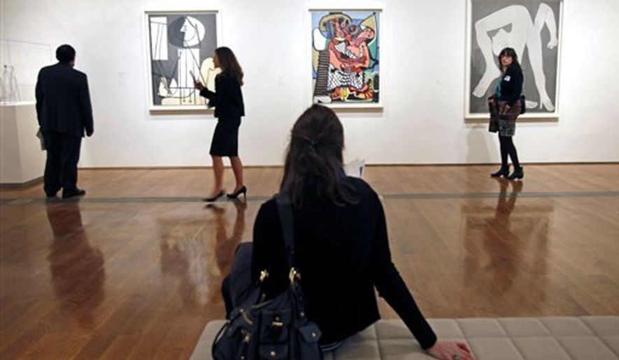 In a Feb. 16, 2011, file photo, visitors at the Virginia Museum of Fine Arts in Richmond, Va., look at paintings by Pablo Picasso at a special preview of the exhibit "Picasso: Masterpieces from Musee National Picasso, Paris." The special exhibit includes 176 works by Picasso, spanning his 80-year career. (AP Photo/ Richmond Times-Dispatch, P. Kevin Morley) ** FILE **