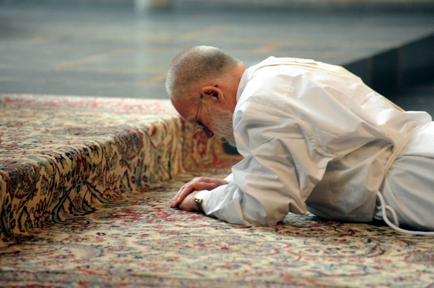In an image provided by the Catholic Archdiocese of Cologne, the Rev. Harm Klueting, a former Lutheran minister, is ordained as a Roman Catholic priest on Tuesday, Feb. 22, 2011, in Cologne. (AP Photo/dapd/PEK/ Michael Kasiske)