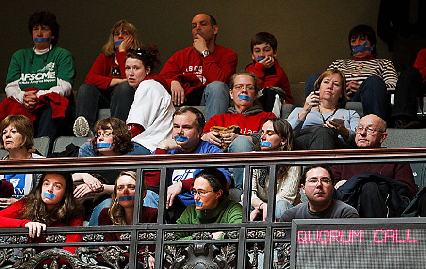 Opponents to the Wisconsin governor's bill to eliminate collective bargaining rights for many state workers watch from the gallery in the Assembly chambers at the state Capitol in Madison, Wis., on Tuesday, Feb. 22, 2011. Large-scale protests are in their eighth day. (AP Photo/Andy Manis)