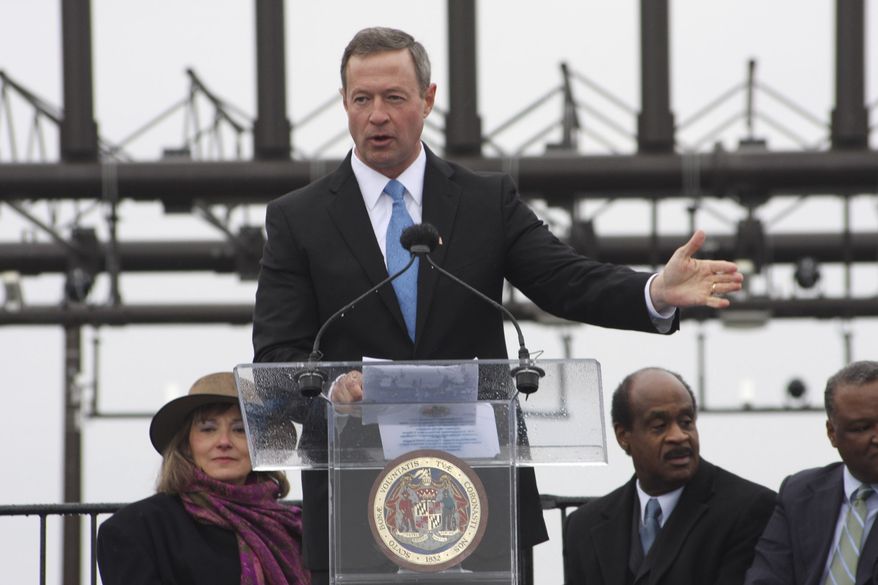 Gov. Martin O’Malley marked the ceremonial ribbon cutting for the first part of Maryland’s Intercounty Connector in Gaithersburg, Md., on Monday, Feb. 21, 2011. Maryland Transportation Secretary Beverley Swaim-Staley is seated to the left and Montgomery County Executive Ike Leggett and Prince George’s County Executive Rushern Baker are to the right. The first 7 miles of the nearly 19-mile road are scheduled to open to traffic on Wednesday. (AP Photo/Brian Witte)